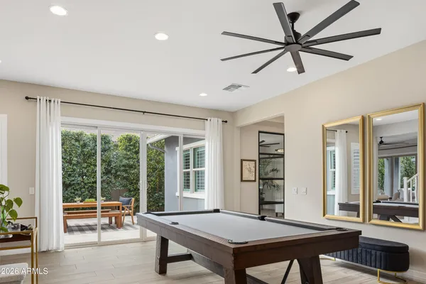 a living room with furniture a window and a table