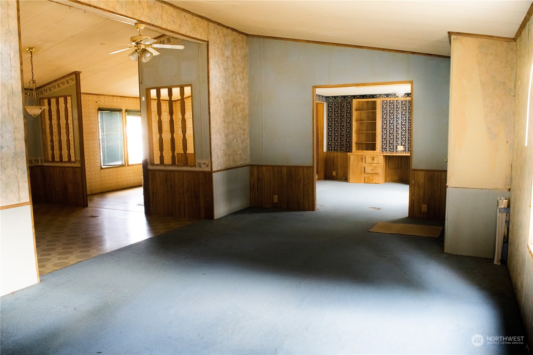 7701 Hardeson Road, Unit 13 Everett, WA 98203 - Photo 7 of 22 a view of hallway with furniture and a refrigerator