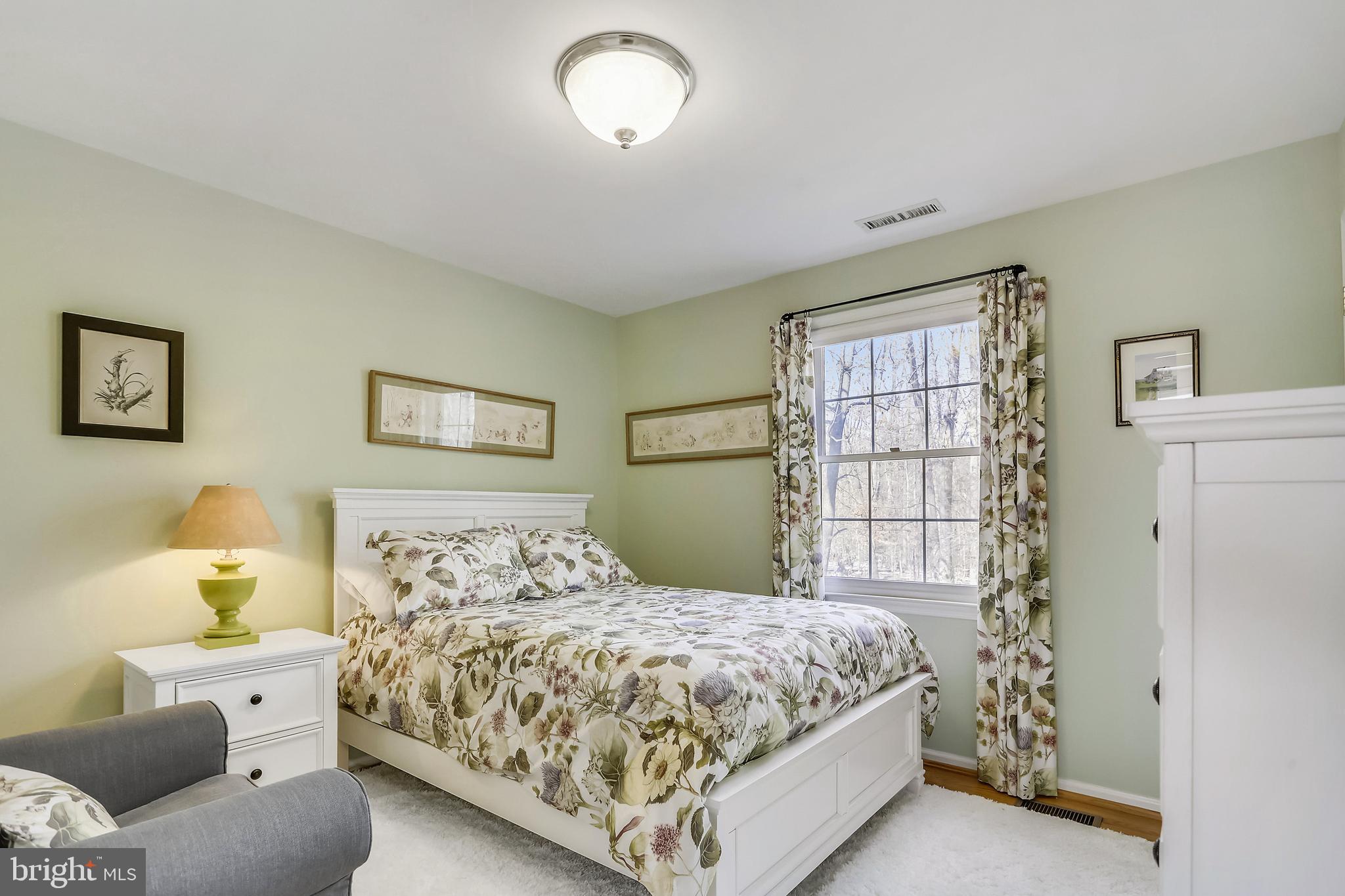 10783 Kinloch Road Silver Spring, MD 20903 - Photo 16 of 43 a bedroom with a bed and a window