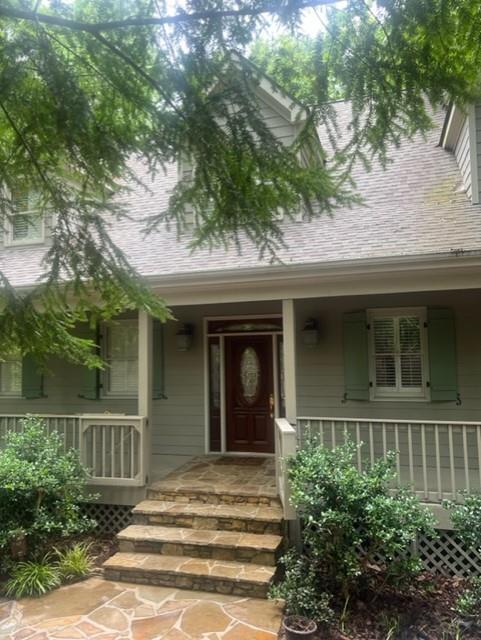 a view of a house with a tree