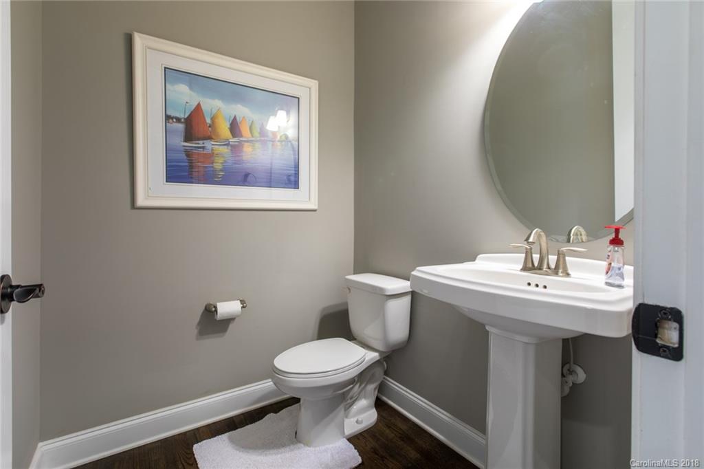 8053 Clems Branch Road Indian Land, SC 29707 - Photo 14 of 25 a bathroom with a toilet a sink and mirror