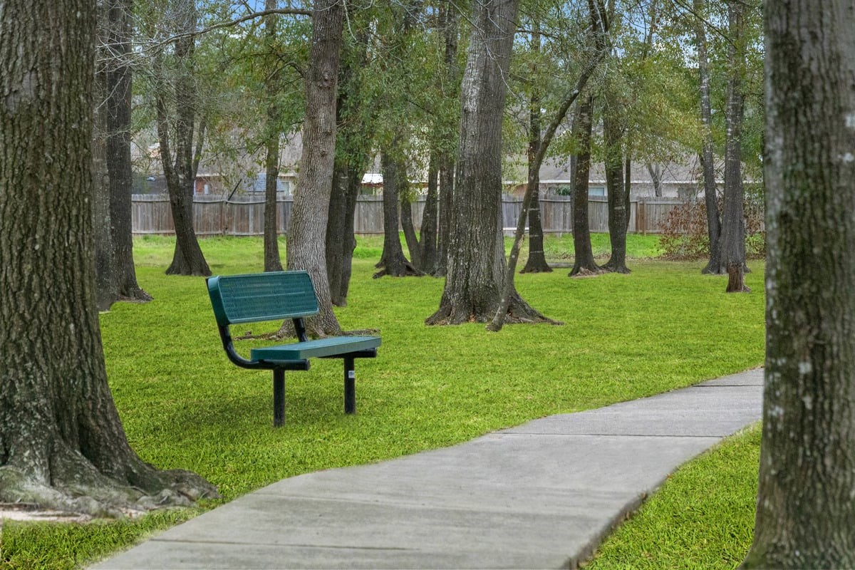 25427 Alpine Switchback Drive Spring, TX 77373 - Photo 3 of 5 a view of a backyard with a garden and trees