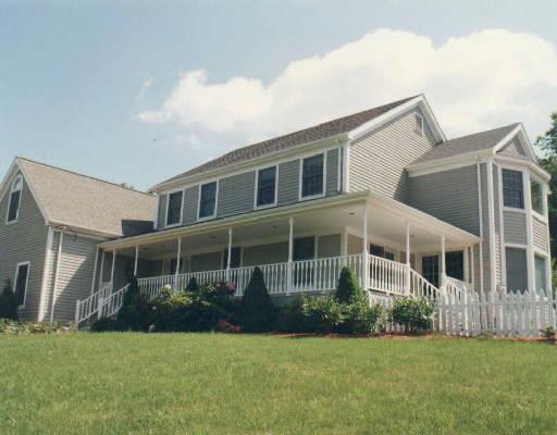 a view of a house with a yard and plants