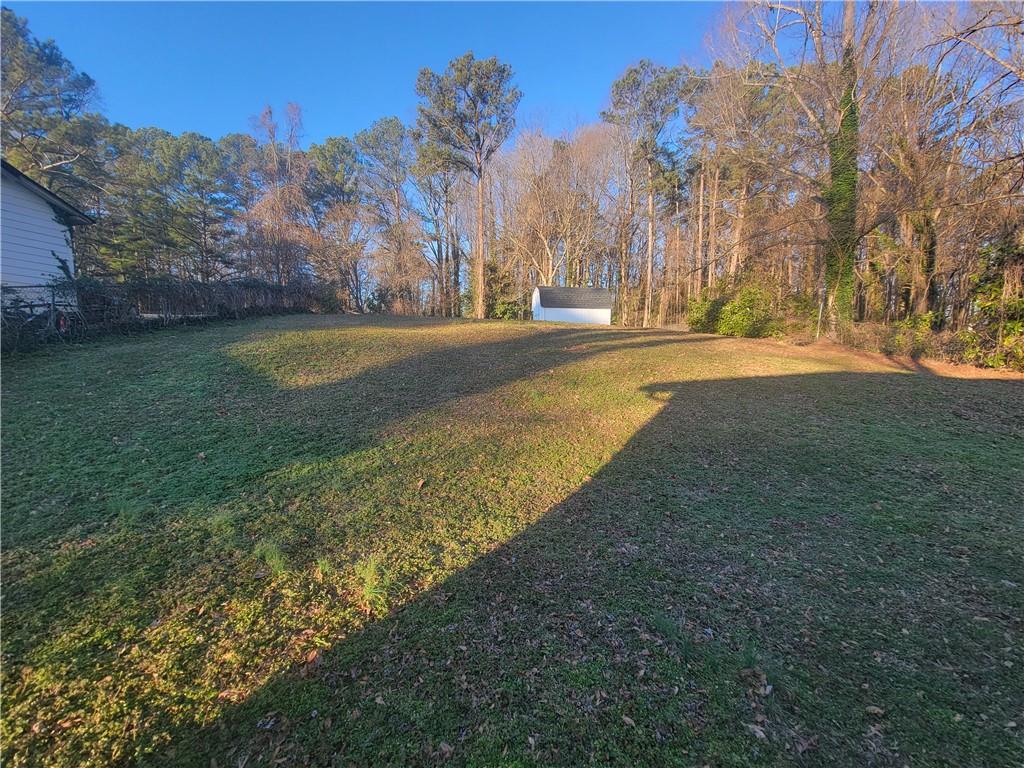 1326 Lori Court Conley, GA 30288 - Photo 3 of 15 a view of yard with large trees