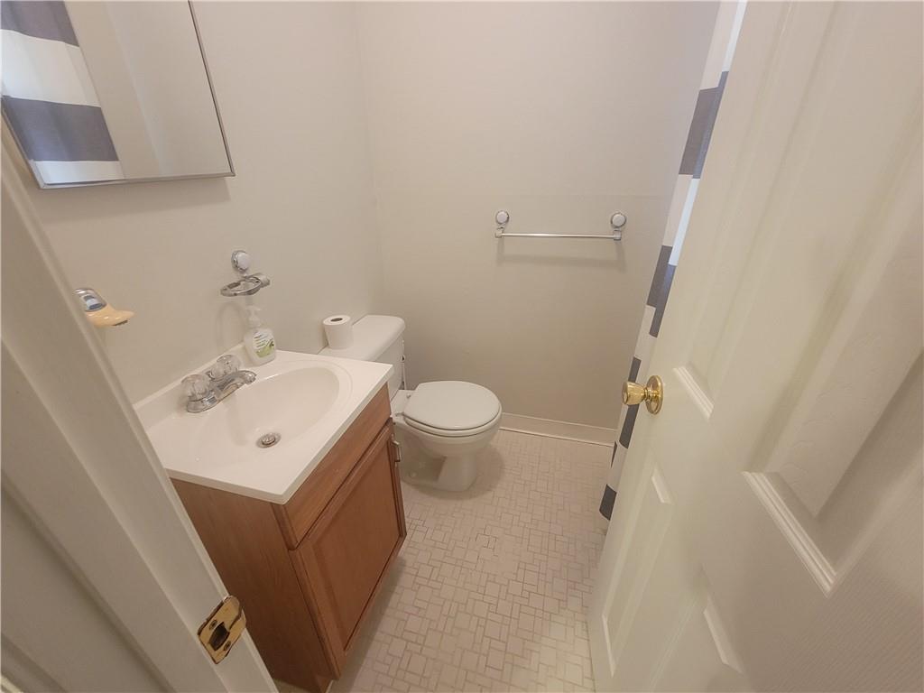 1326 Lori Court Conley, GA 30288 - Photo 7 of 15 a bathroom with a sink toilet and a mirror