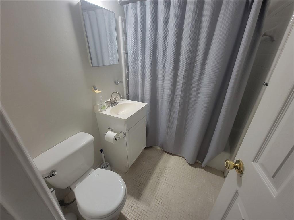 1326 Lori Court Conley, GA 30288 - Photo 9 of 15 a white toilet sitting next to a sink