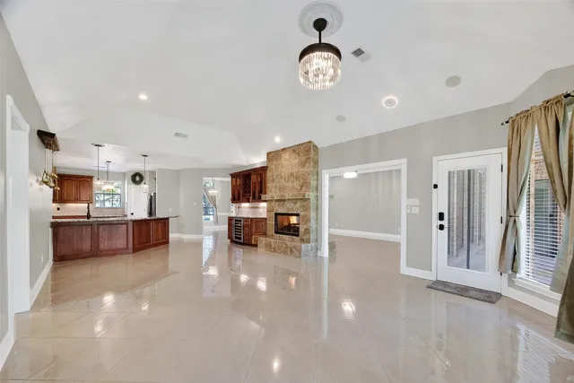 a living room with furniture and large windows