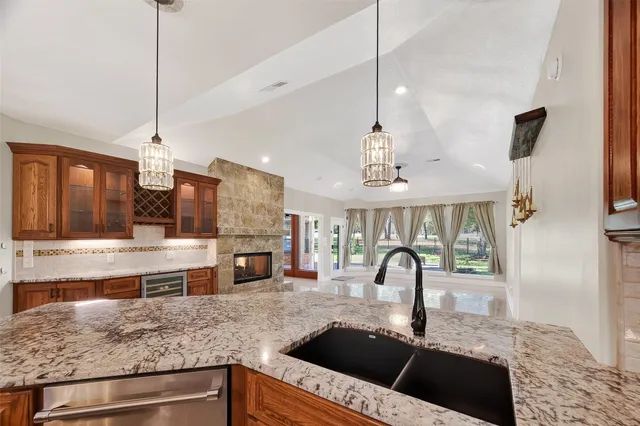 a kitchen with stainless steel appliances granite countertop a stove and a sink