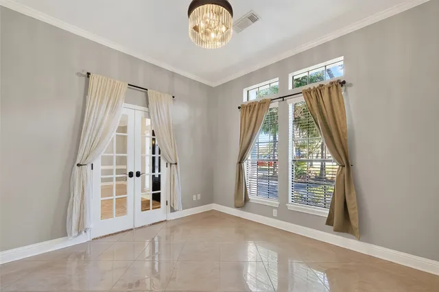 a view of an empty room and a window