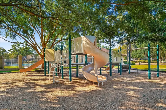 swimming pool view with a seating space