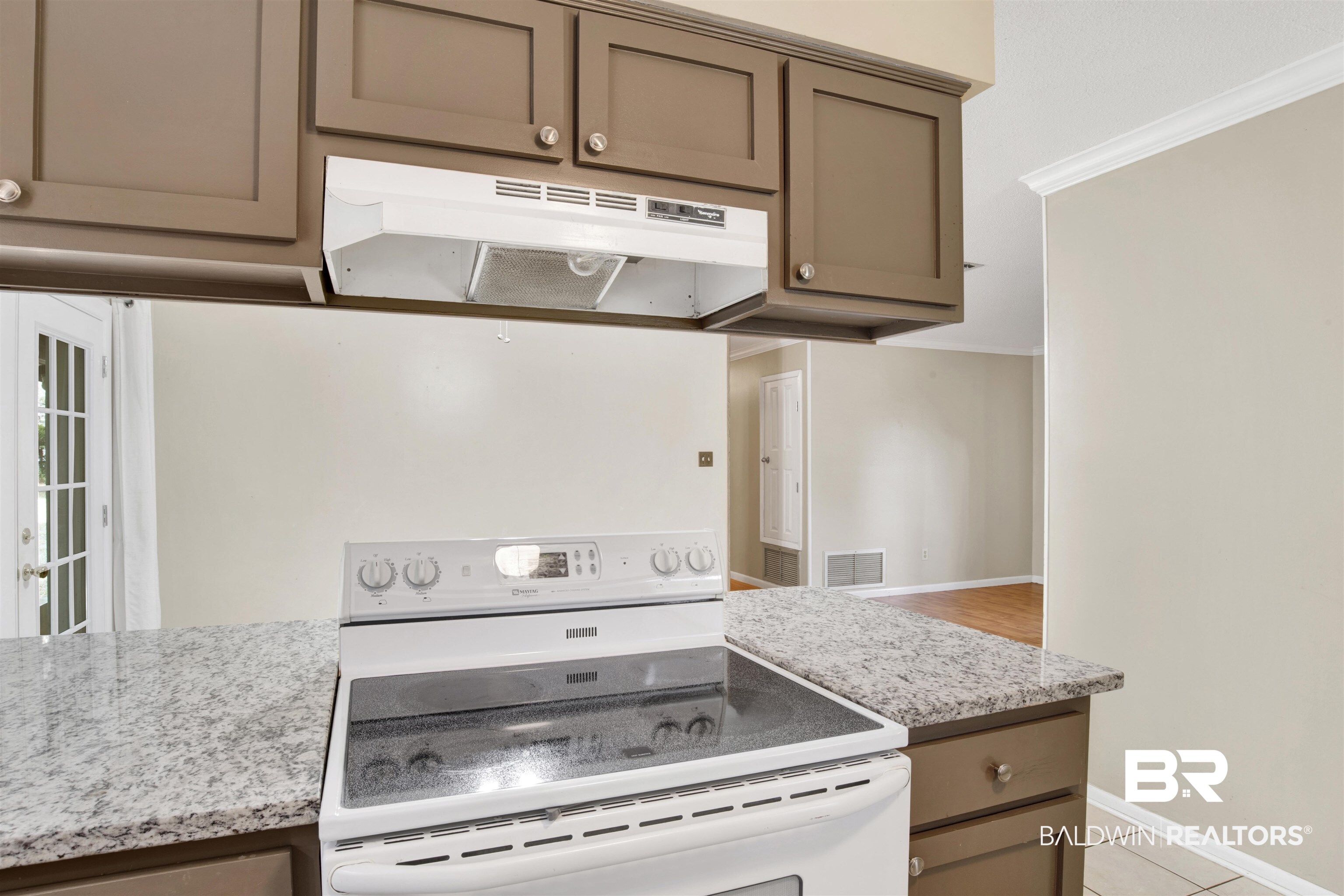 3560 Creekway Road Mobile, AL 36619 - Photo 7 of 24 Kitchen with light tile patterned floors, light stone counters, and white electric stove