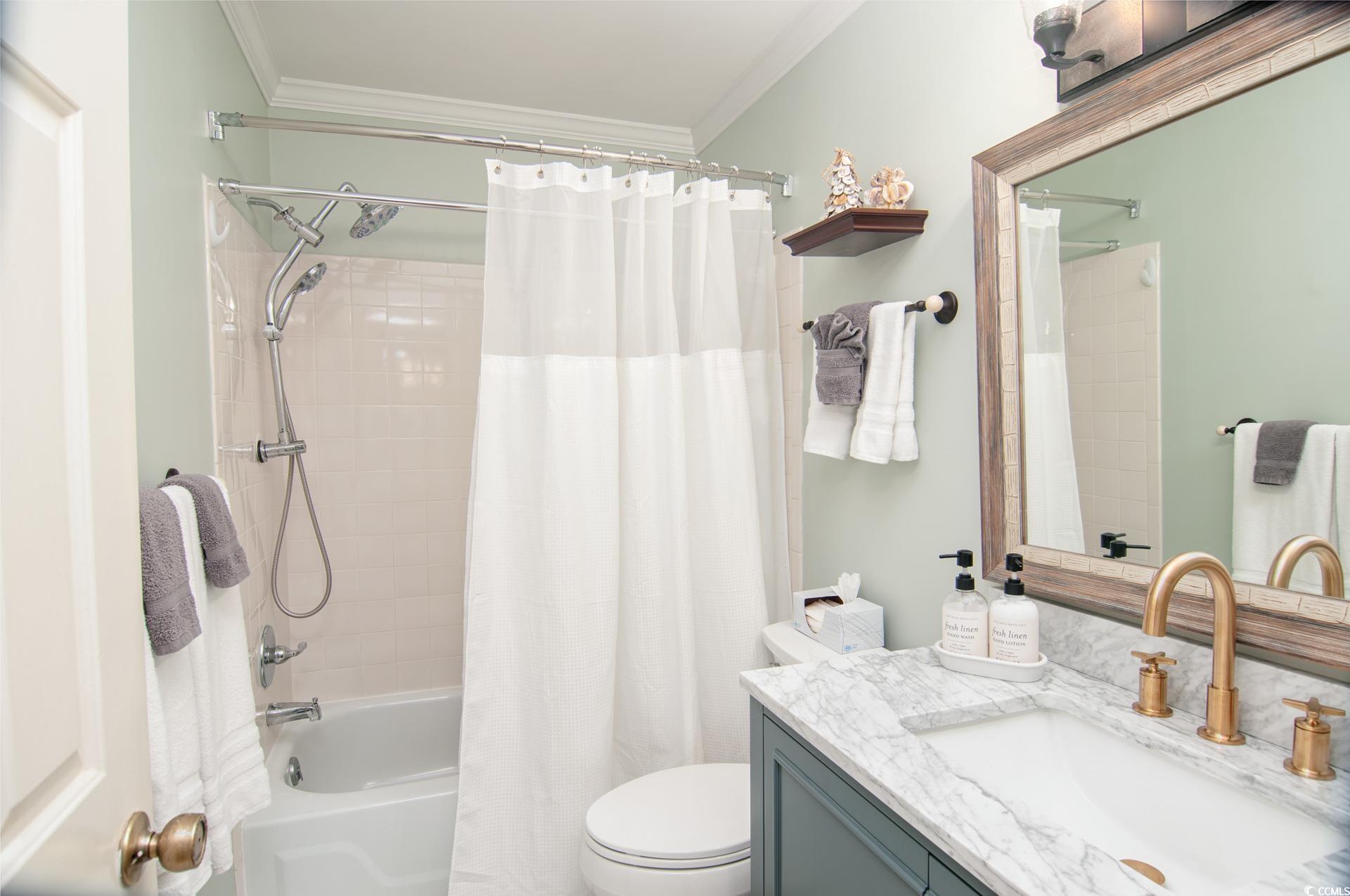 27 Pheasant Loop, Unit 293 Georgetown, SC 29440 - Photo 14 of 23 Full bath with shower / bath combo, vanity, and crown molding