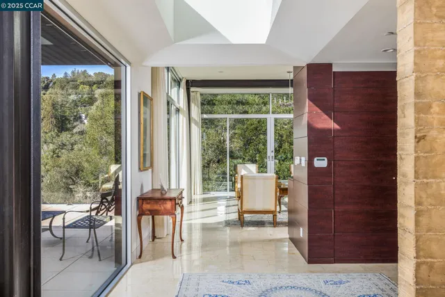 a view of living room with furniture and floor to ceiling windows