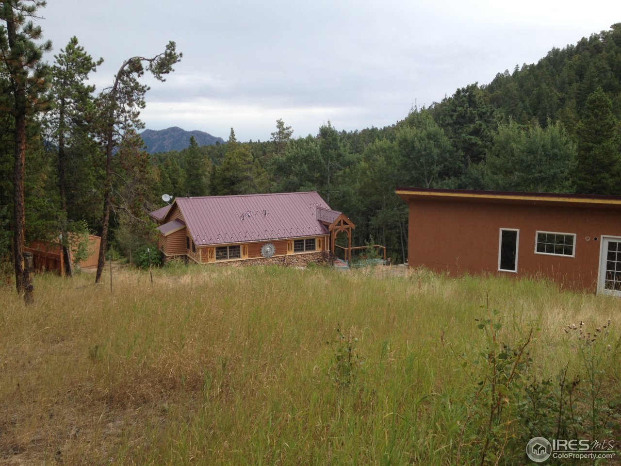 11877 Brook Road Golden, CO 80403 - Photo 19 of 25 a view of a house with a yard
