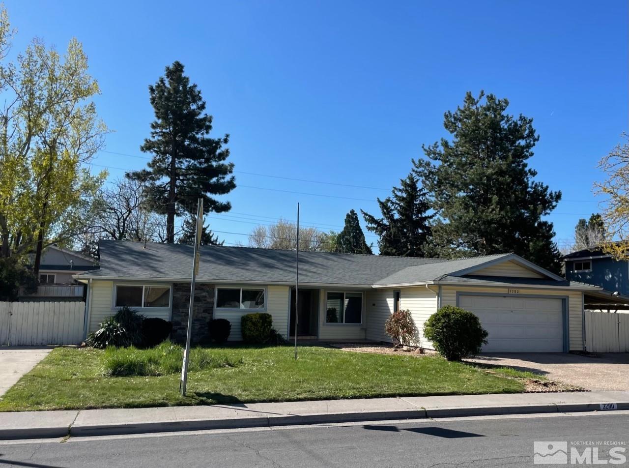 3280 Idlewild Drive Reno, NV 89509 - Photo 1 of 22 a front view of a house with a garden