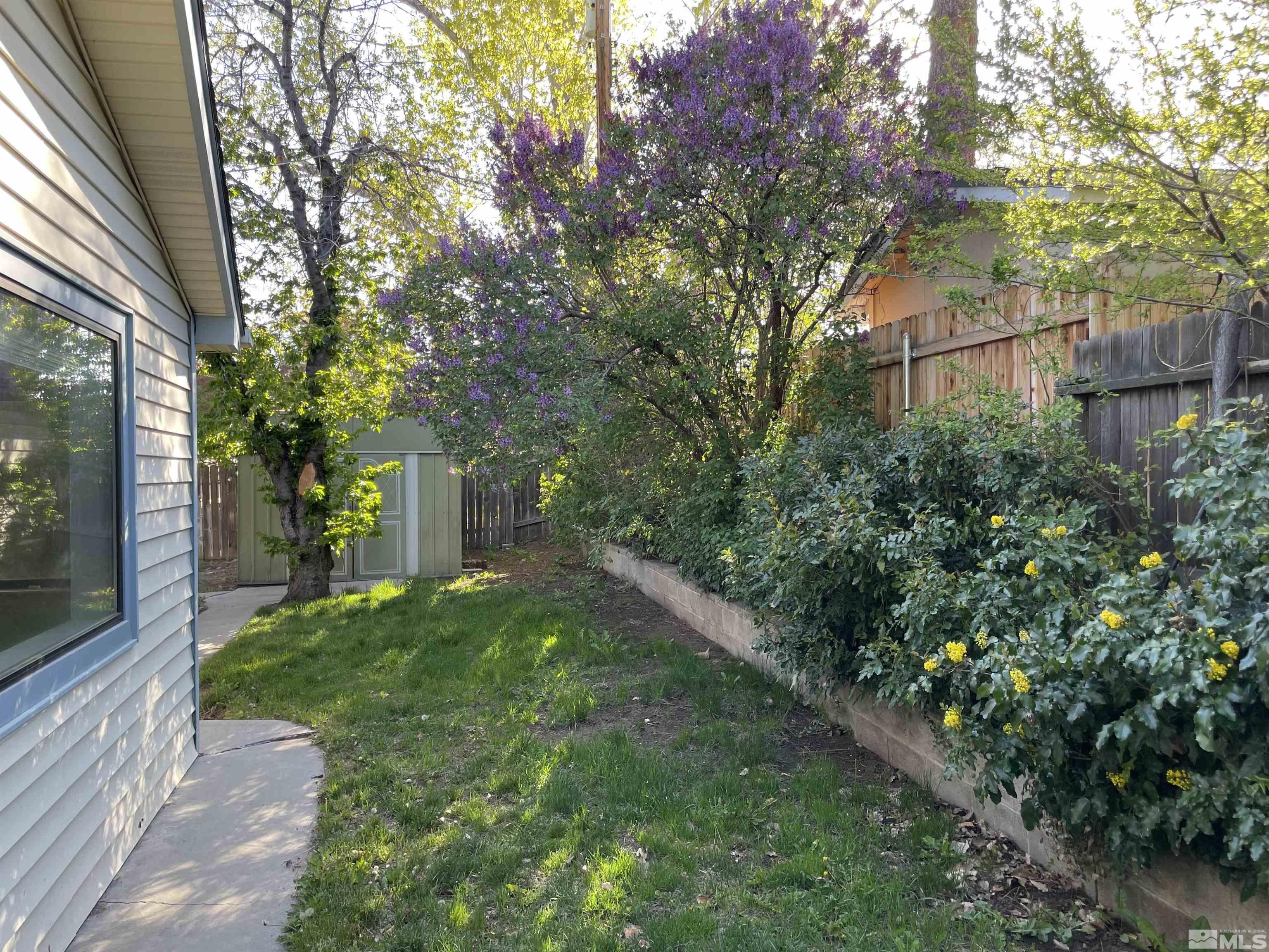 3280 Idlewild Drive Reno, NV 89509 - Photo 20 of 22 a backyard of a house with lots of green space