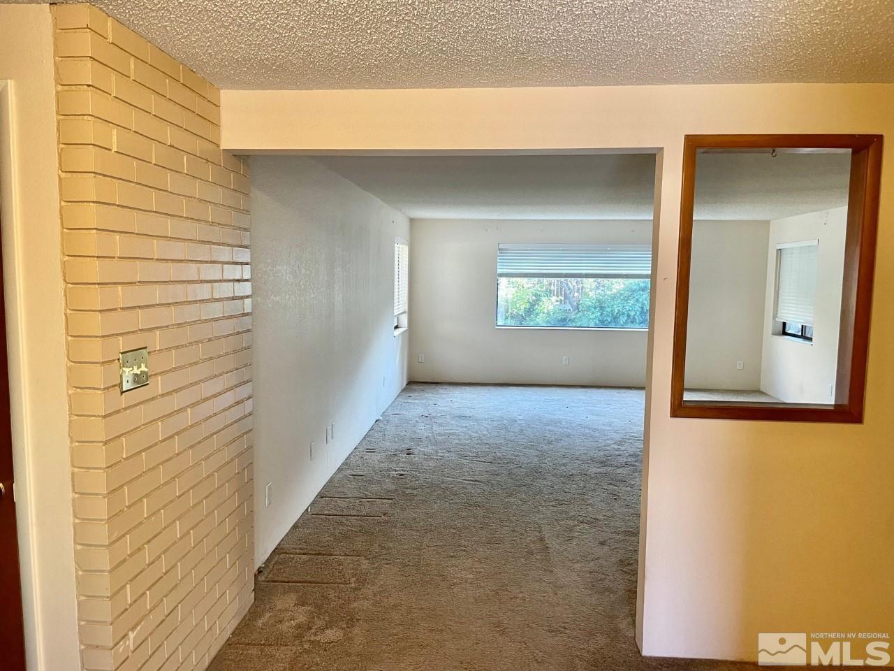 3280 Idlewild Drive Reno, NV 89509 - Photo 2 of 22 a view of a hallway with windows