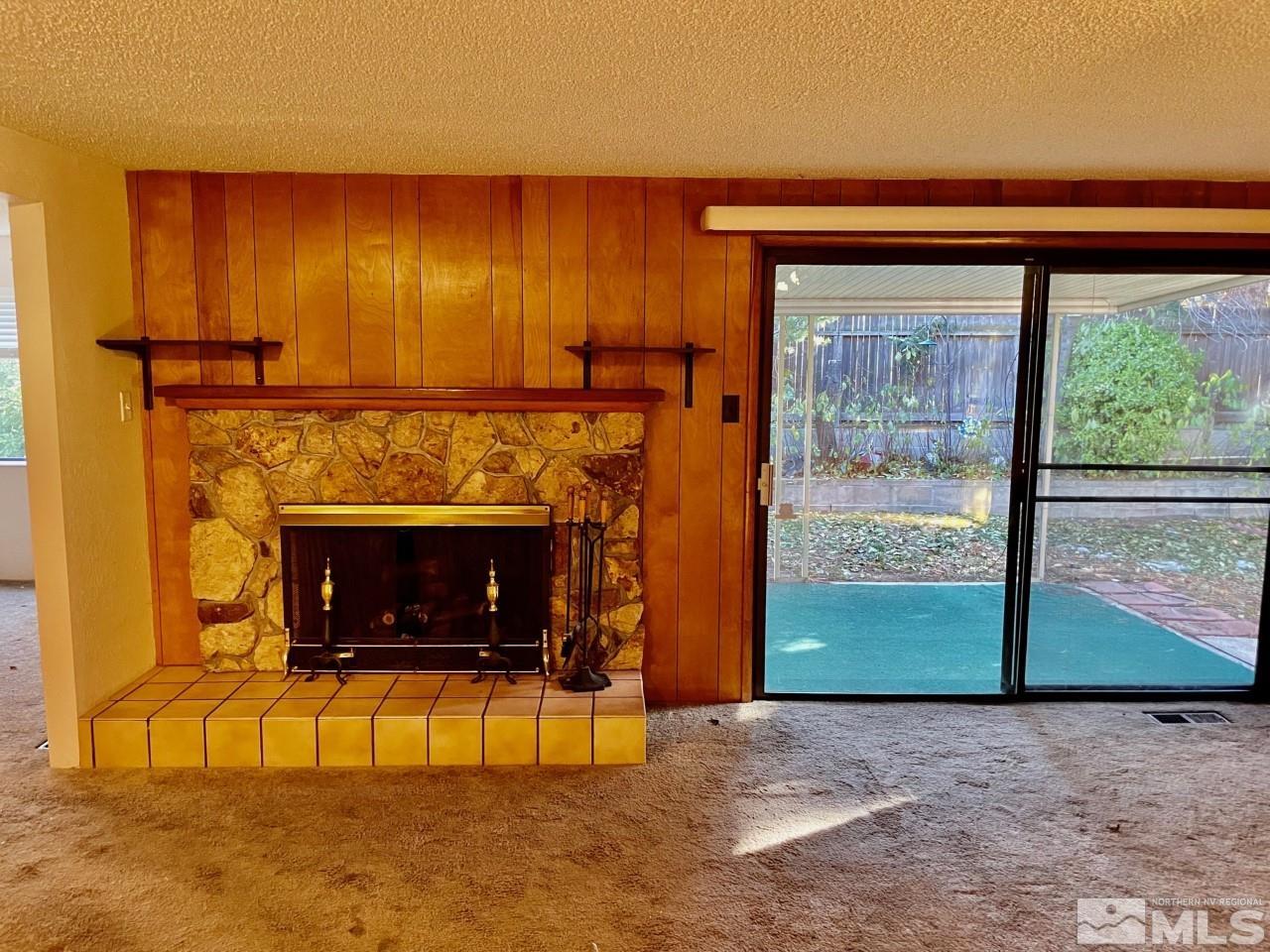 3280 Idlewild Drive Reno, NV 89509 - Photo 4 of 22 a view of an empty room with a fireplace