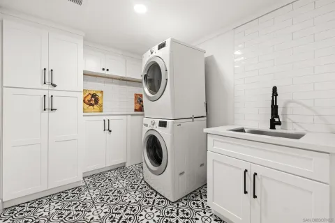 a bathroom with a sink a mirror and a shower