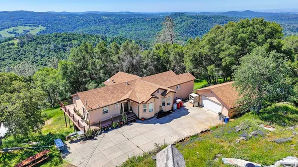 an aerial view of a house with a garden