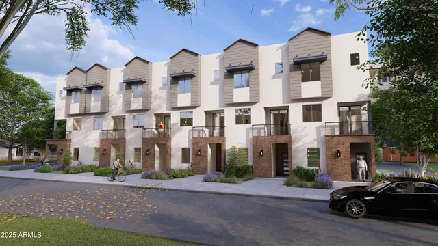 a couple of cars parked in front of brick building