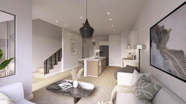 a living room with furniture and kitchen view