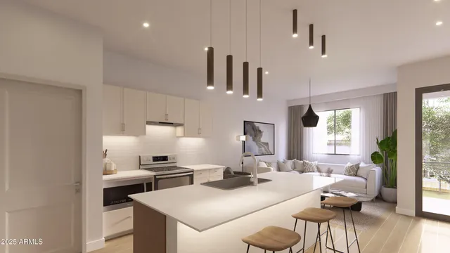 a kitchen with a sink a stove and chairs