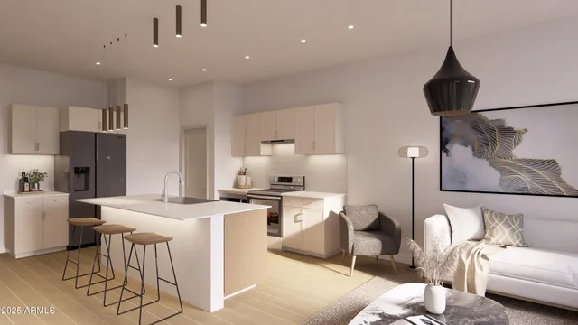 a kitchen with stainless steel appliances kitchen island granite countertop a sink a stove and a refrigerator