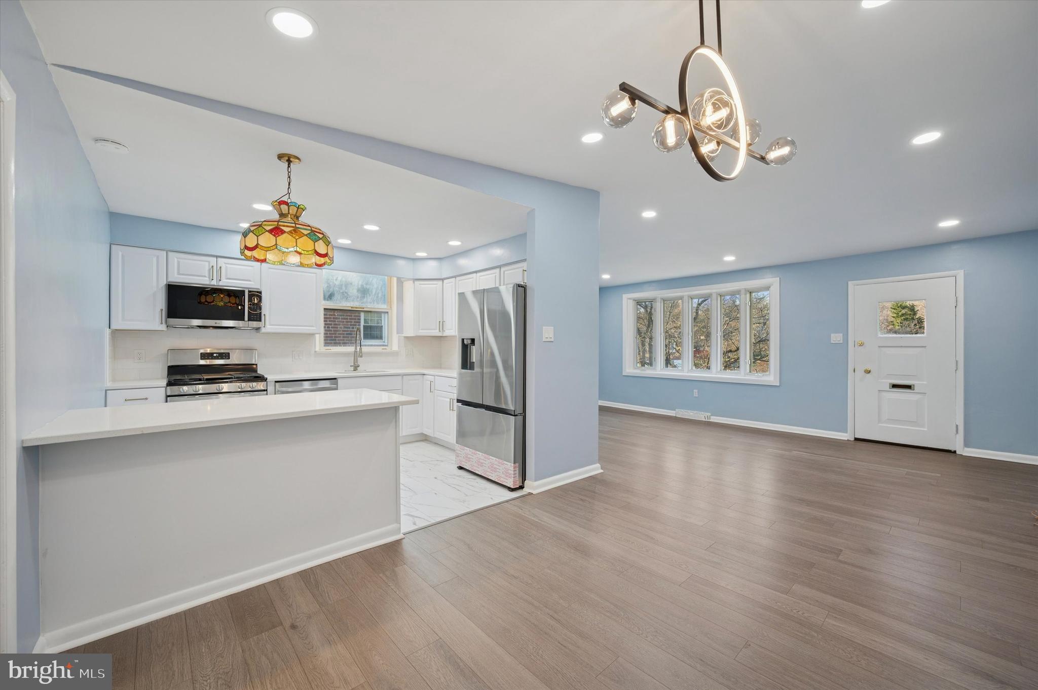 555 Wanamaker Road Jenkintown, PA 19046 - Photo 3 of 26 a kitchen with stainless steel appliances granite countertop a refrigerator and a stove top oven