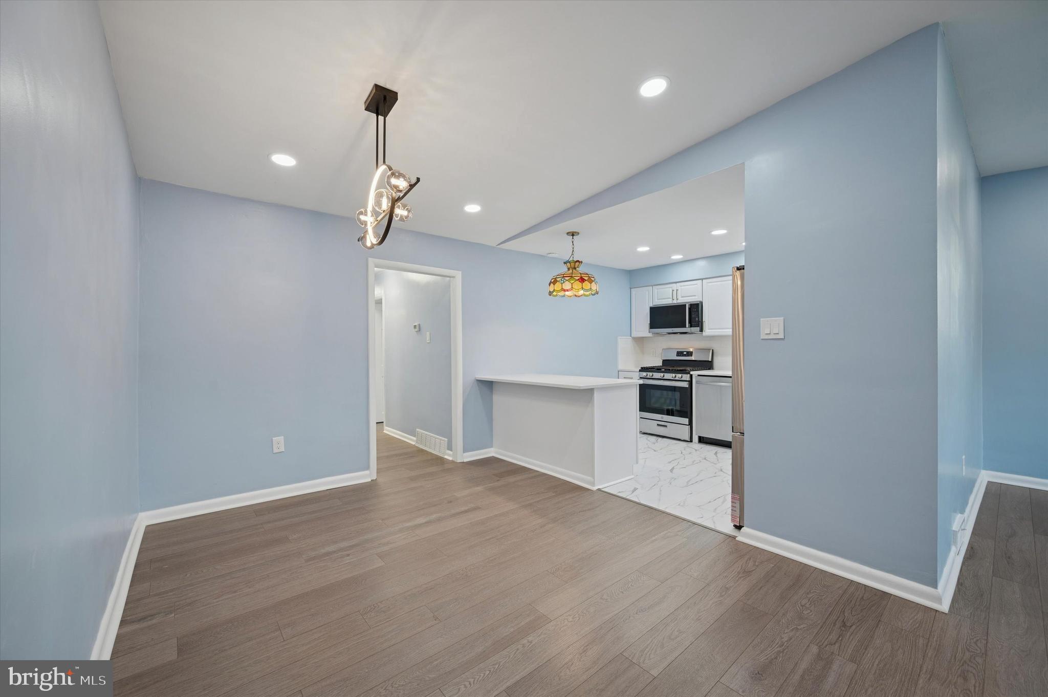 555 Wanamaker Road Jenkintown, PA 19046 - Photo 9 of 26 a view of a kitchen with a sink and wooden floor