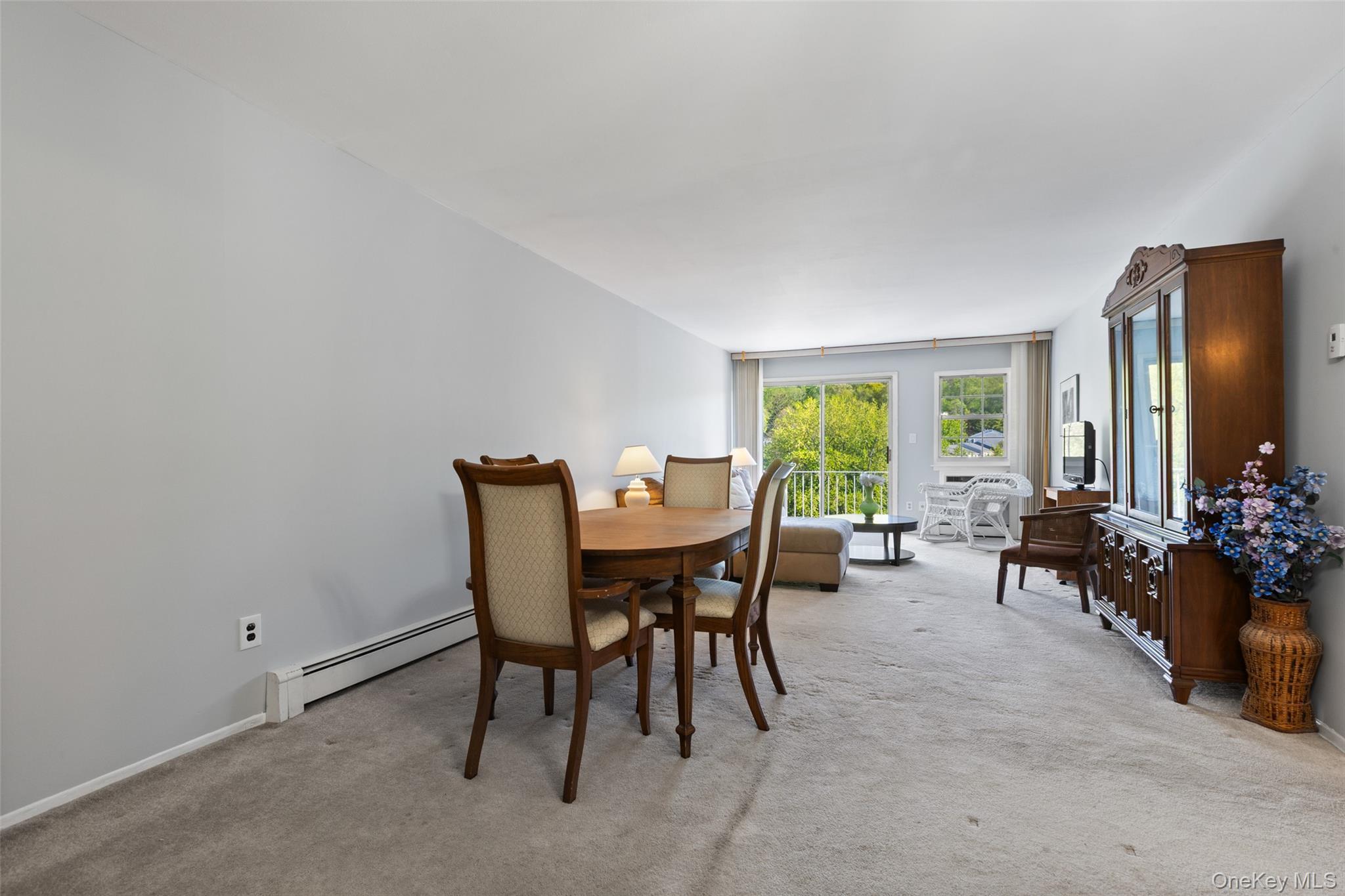 1840 Crompond Road, Unit 5C2 Peekskill, NY 10566 - Photo 6 of 27 a view of a dining room with furniture and a large window