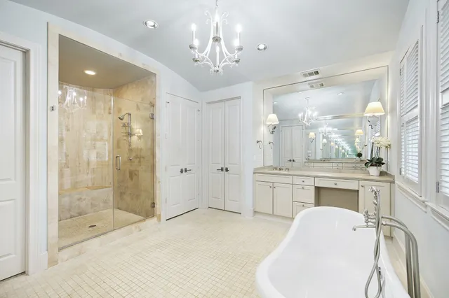 a large bathroom with a glass door shower