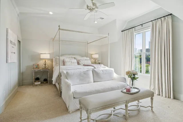 a bedroom with furniture and a chandelier