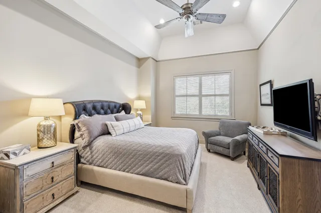 a bedroom with two beds and a window