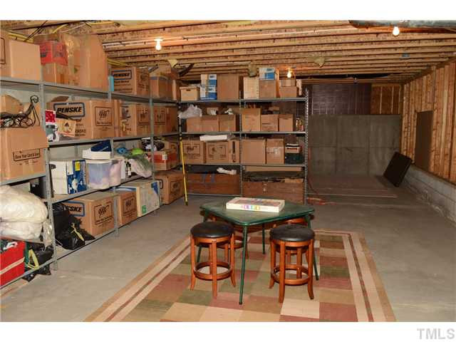 4457 Fairview Ridge Lane Apex, NC 27539 - Photo 20 of 25 Double doors of the 18x38 basement open to the backyard. Basement