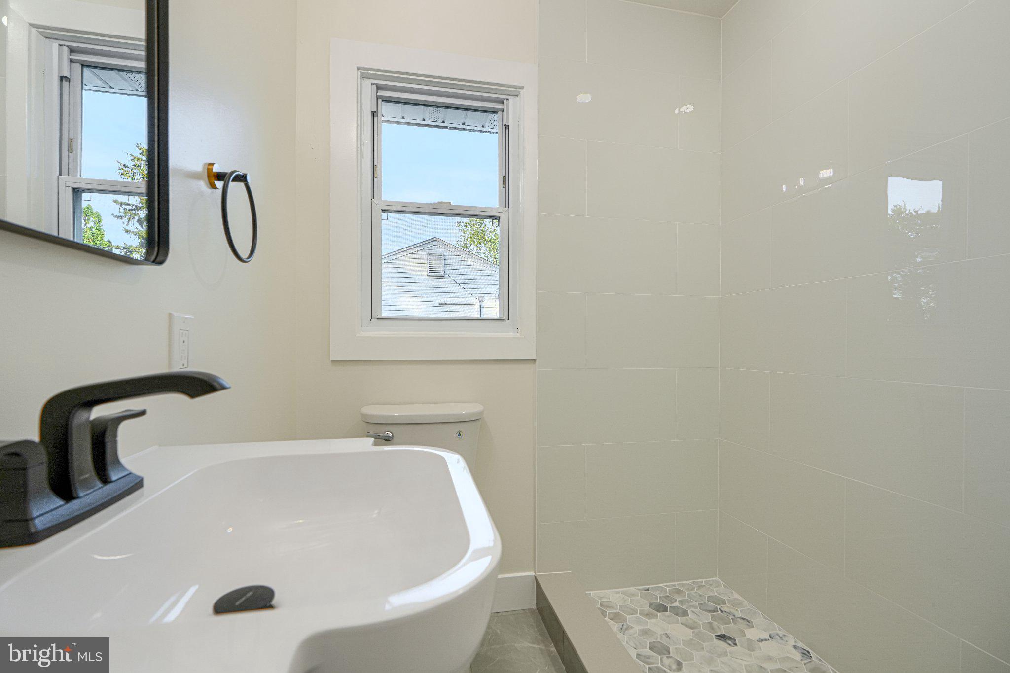103 Stoneleigh Road Bel Air, MD 21014 - Photo 34 of 45 Sleek modern bathroom with natural light.