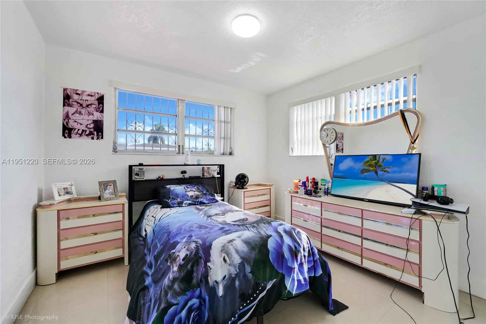 860 Southeast 7th Avenue Hialeah, FL 33010 - Photo 12 of 16 a bedroom with a bed and a dresser
