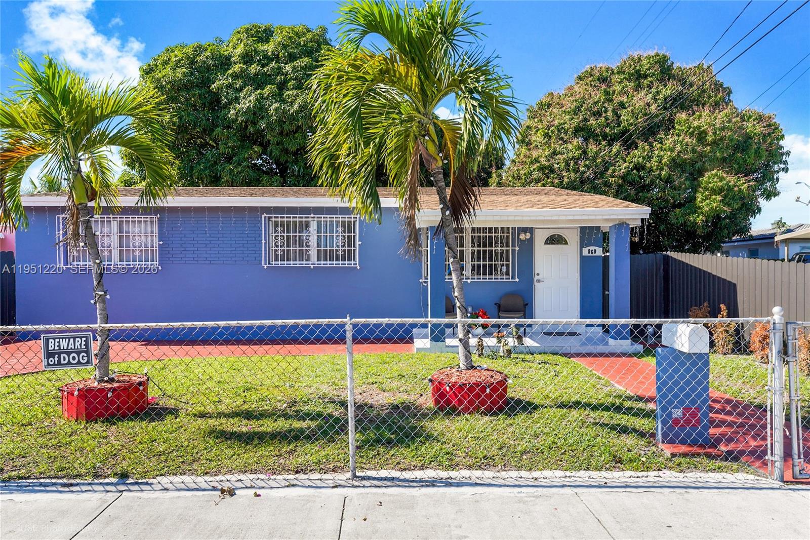 860 Southeast 7th Avenue Hialeah, FL 33010 - Photo 16 of 16 a front view of a house with yard