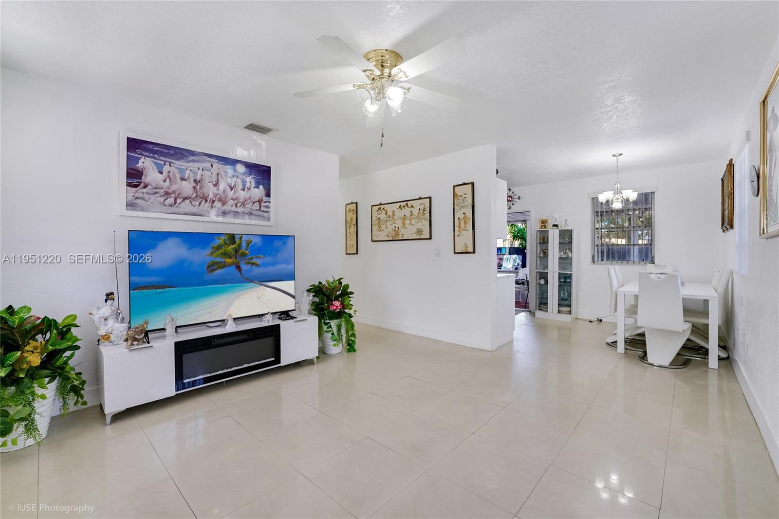 860 Southeast 7th Avenue Hialeah, FL 33010 - Photo 5 of 16 a living room with furniture and flowers