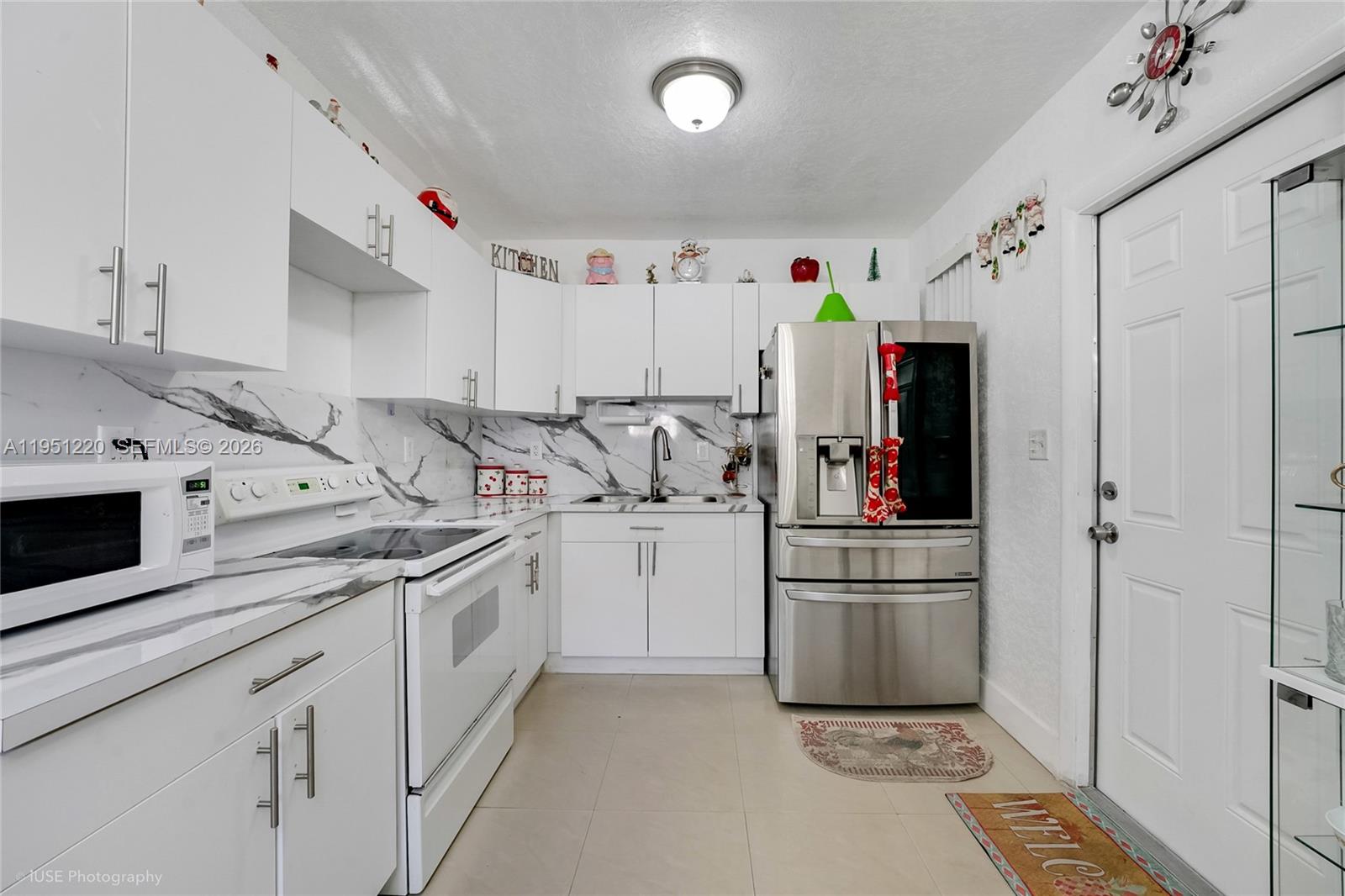 860 Southeast 7th Avenue Hialeah, FL 33010 - Photo 7 of 16 a kitchen with appliances a sink and cabinets