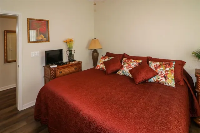 a bed room with two bed and a tv