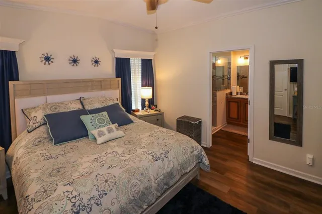 a bedroom with bed and window