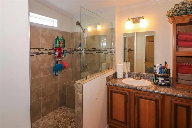 a bathroom with a sink vanity and mirror
