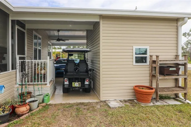 a view of a patio with table and chairs potted plants