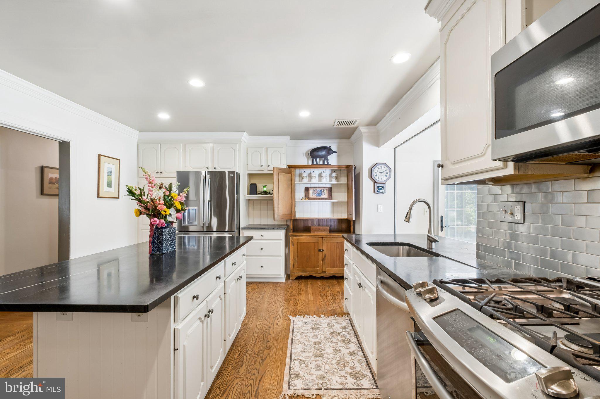 713 Alene Road Ambler, PA 19002 - Photo 10 of 40 a kitchen with stainless steel appliances granite countertop a stove and a sink