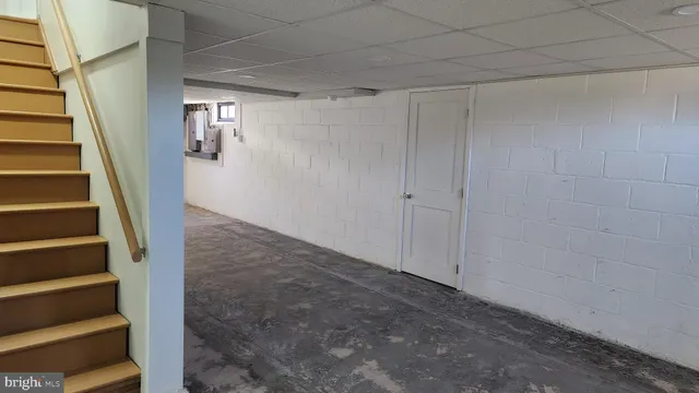 a view of an empty room with stairs