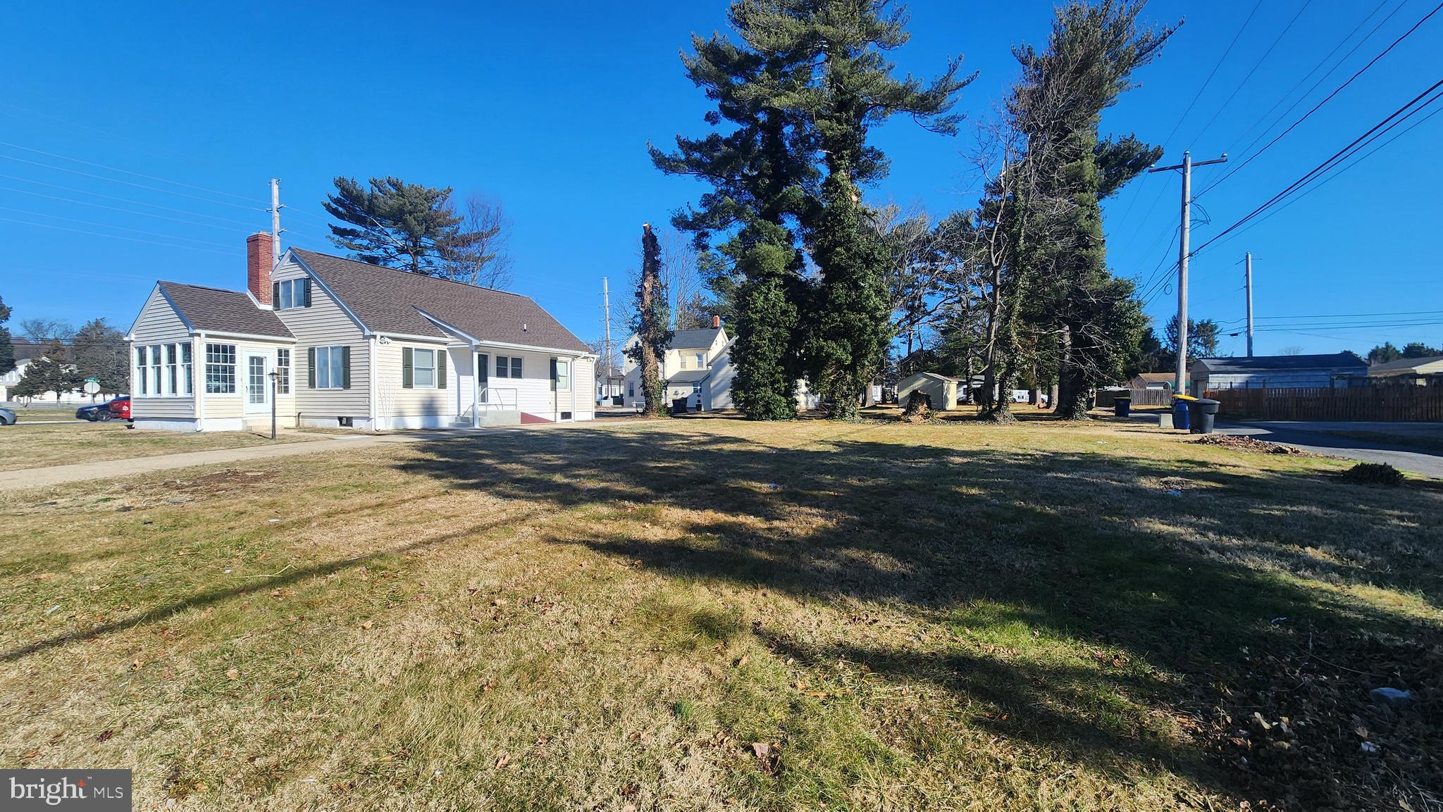 706 East Division Street Dover, DE 19901 - Photo 4 of 20 a front view of a house with a yard