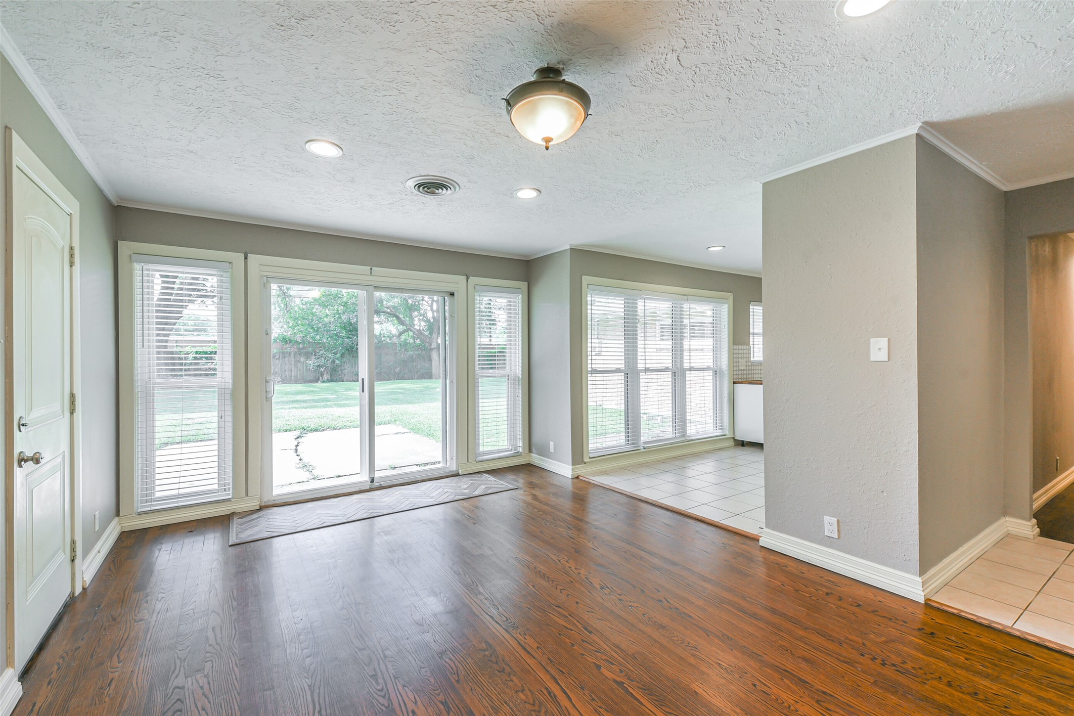 10251 Old Orchard Road La Porte, TX 77571 - Photo 4 of 15 a view of an empty room with wooden floor and a window