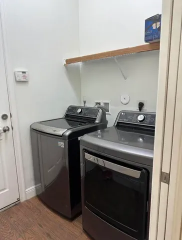 a close view of a stove top oven and cabinets