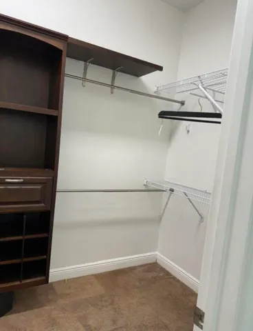 a view of an empty walk in closet